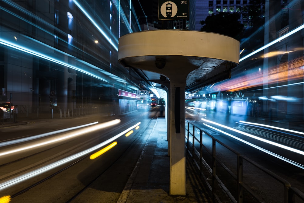 a city street filled with lots of traffic at night