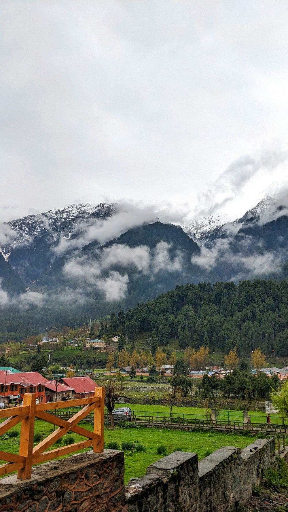 a scenic view of a mountain range with clouds in the sky