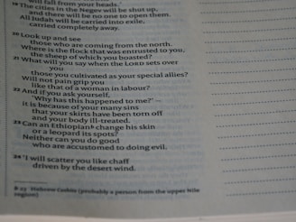 A close-up of highlighted biblical texts with Greek and Hebrew annotations.