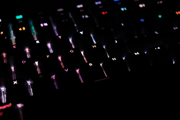 Close-up of a customer typing on a new keyboard with colorful backlighting.