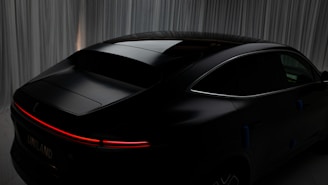 The futuristic Curvv model showcased under bright showroom lights, emphasizing its curves.