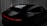 A sleek, dark-colored car is angled from the rear, showcasing its smooth curves and modern design. The setting includes a dimly lit environment with vertical draped fabrics contrasting against the vehicle's glossy surface. A sharp, continuous red light strip runs across the back, adding a futuristic touch.