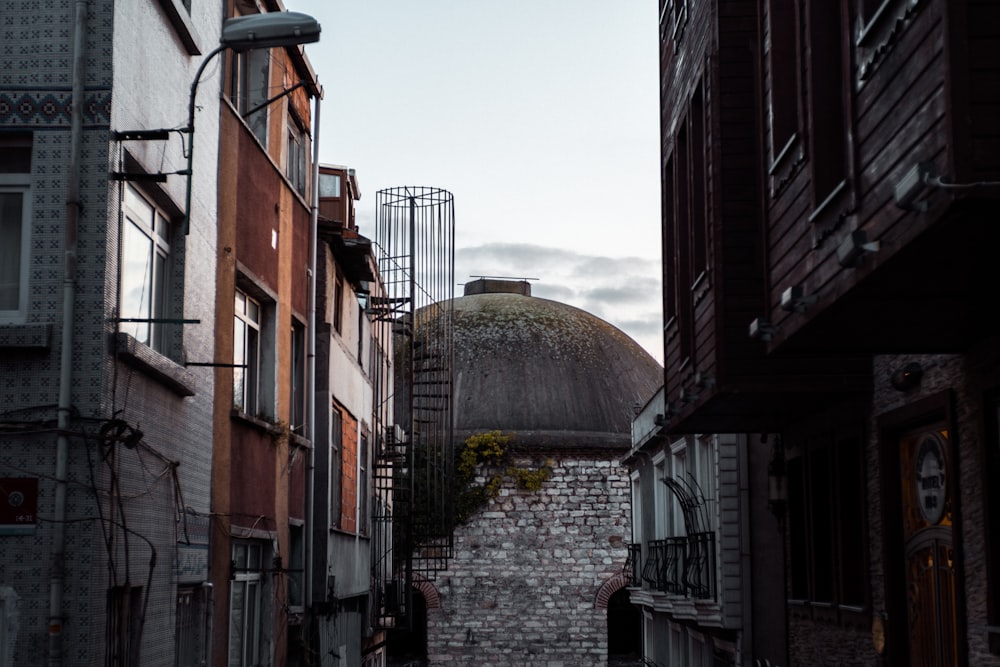 a view of a building from a narrow alley way