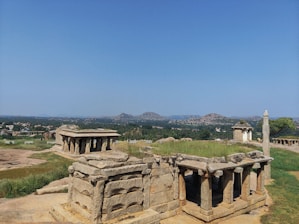 Ancient temples nestled among lush greenery in Shandong's countryside under a clear blue sky