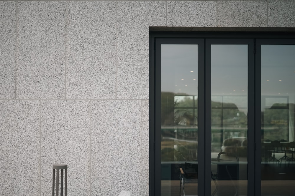 a chair sitting in front of a large window