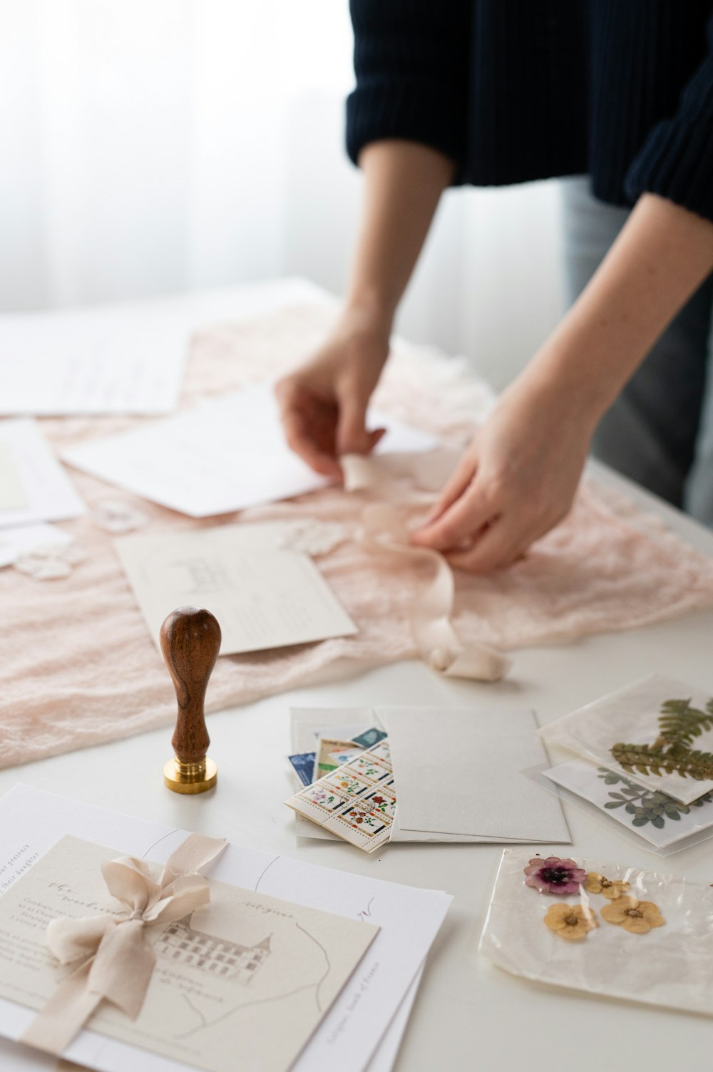 a person is making cards on a table