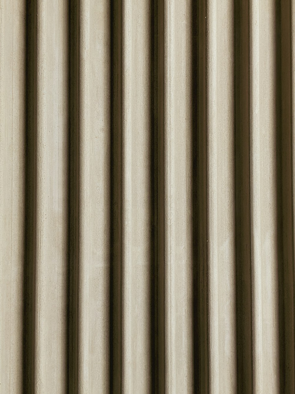 a close up of a curtain with vertical stripes