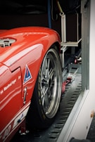 An enclosed trailer transporting luxury vehicles safely.