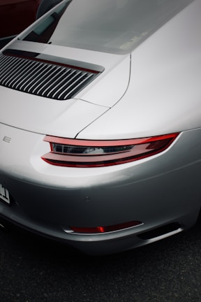 Rear view of a popular sedan car with shiny silver paint and clean lines.