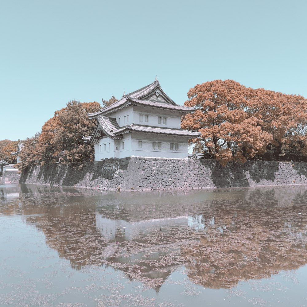 a large building sitting on top of a body of water