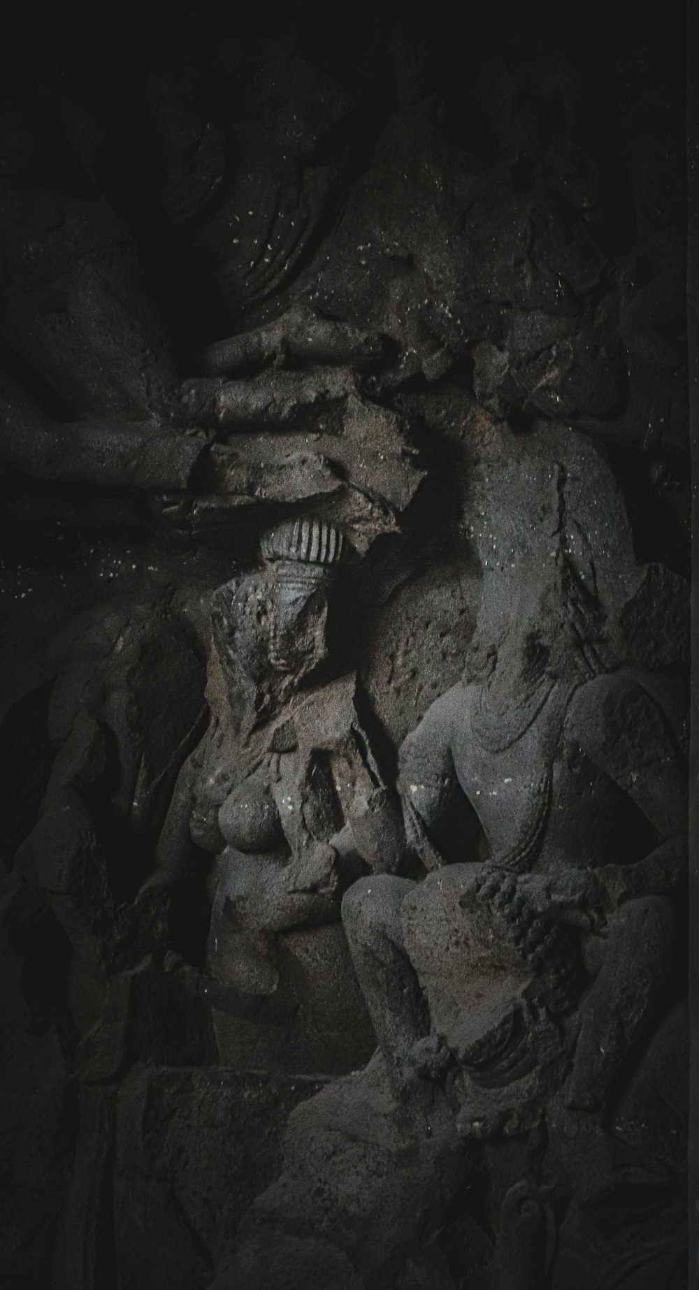 a black and white photo of a skeleton in a cave