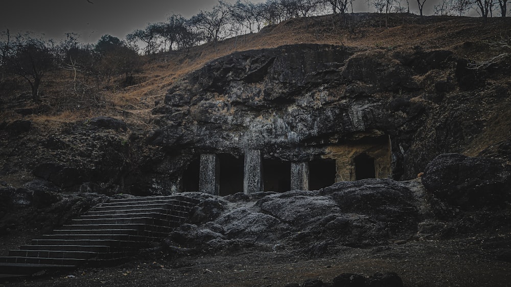 a cave with steps leading up to it