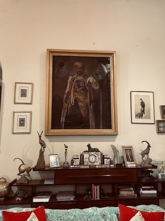 A stylish living room with several crystal photo frames displayed on shelves and a side table.