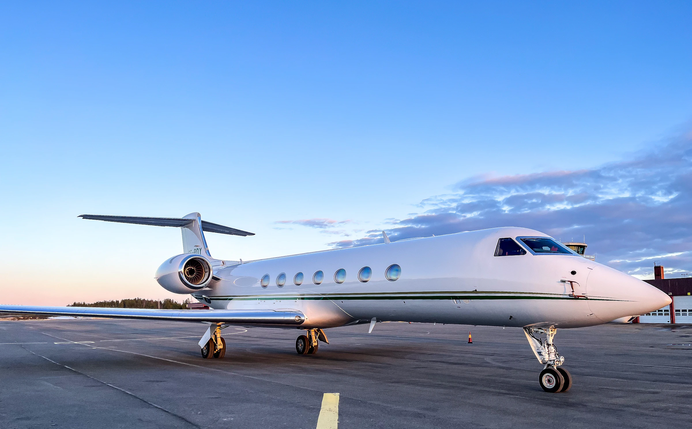 Business jet parked on the apron at first light