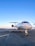A beautifully detailed private jet parked on a runway.