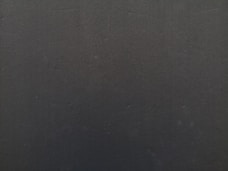 a close up of a cell phone with a black background