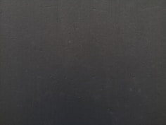 a close up of a cell phone with a black background