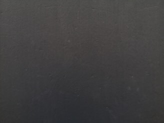 a close up of a cell phone with a black background