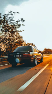 Dynamic shot of the axv tm-fs accelerating on an open highway, the dark theme blending with the night sky.