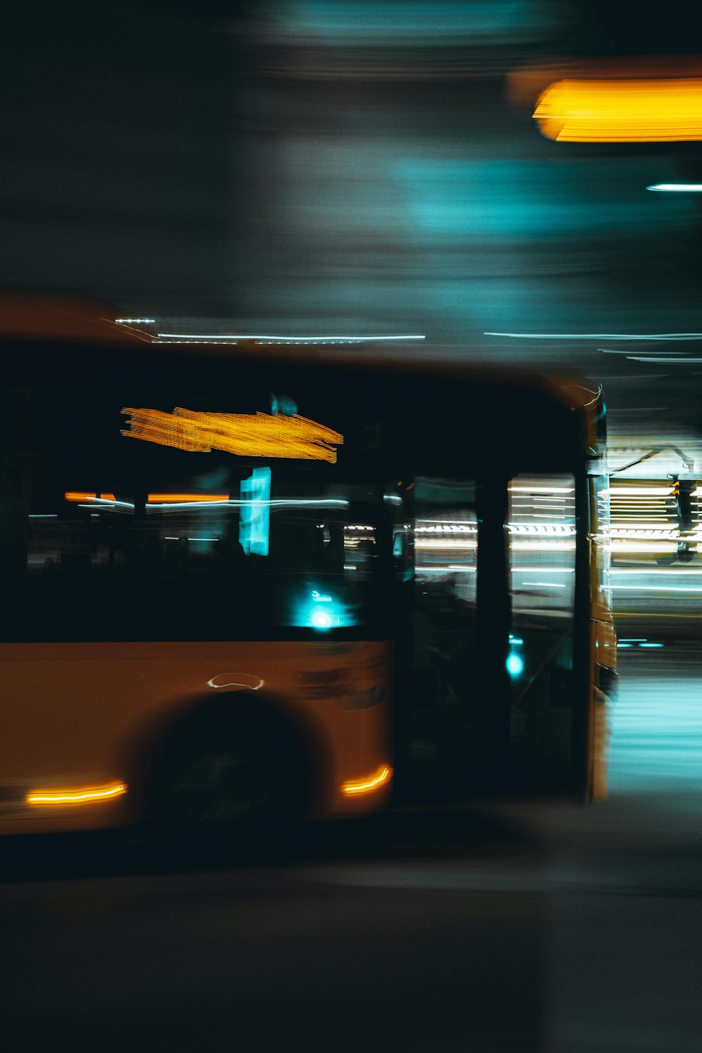 a bus driving down a street at night