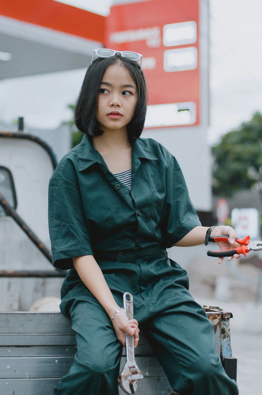 a woman sitting on the back of a truck