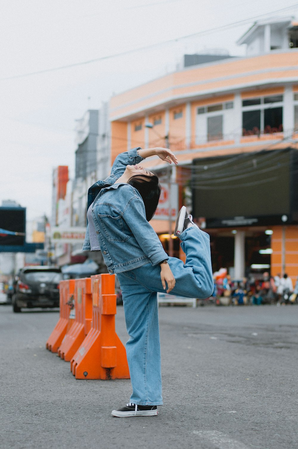 a person standing on a skateboard on a city street