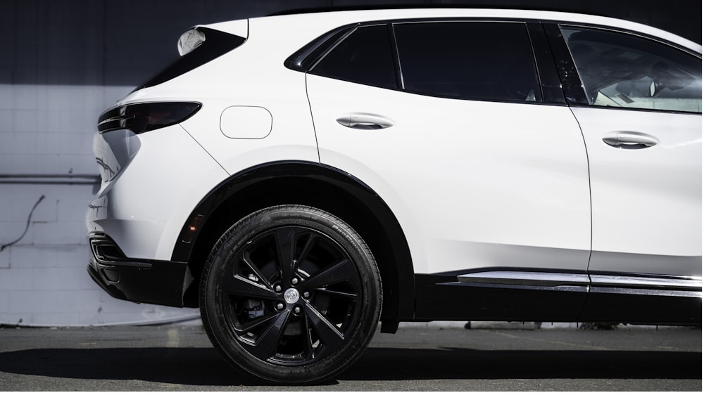 a white suv parked in a parking lot