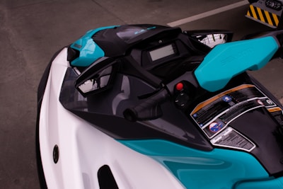 a close up of a blue and white motorcycle