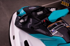 a close up of a blue and white motorcycle