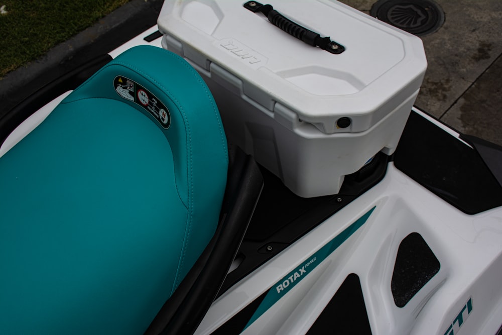 a motor scooter with a cooler on top of it