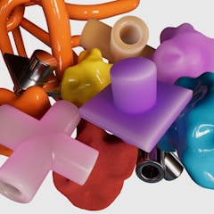 A collection of finished 3D printed items in various shapes.