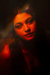 a woman in a dark room with her eyes closed