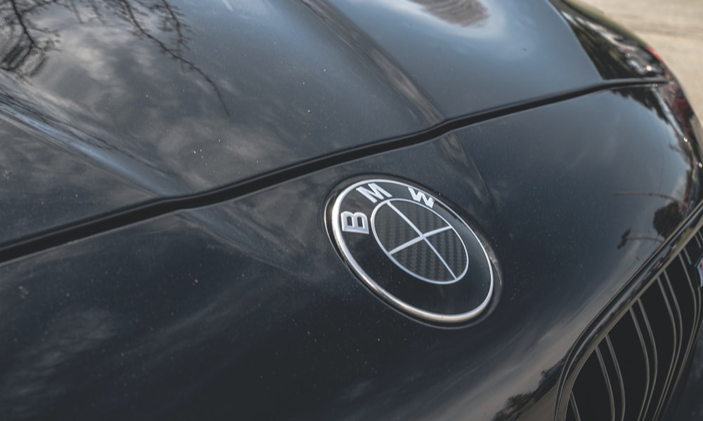 a close up of the emblem on a black sports car