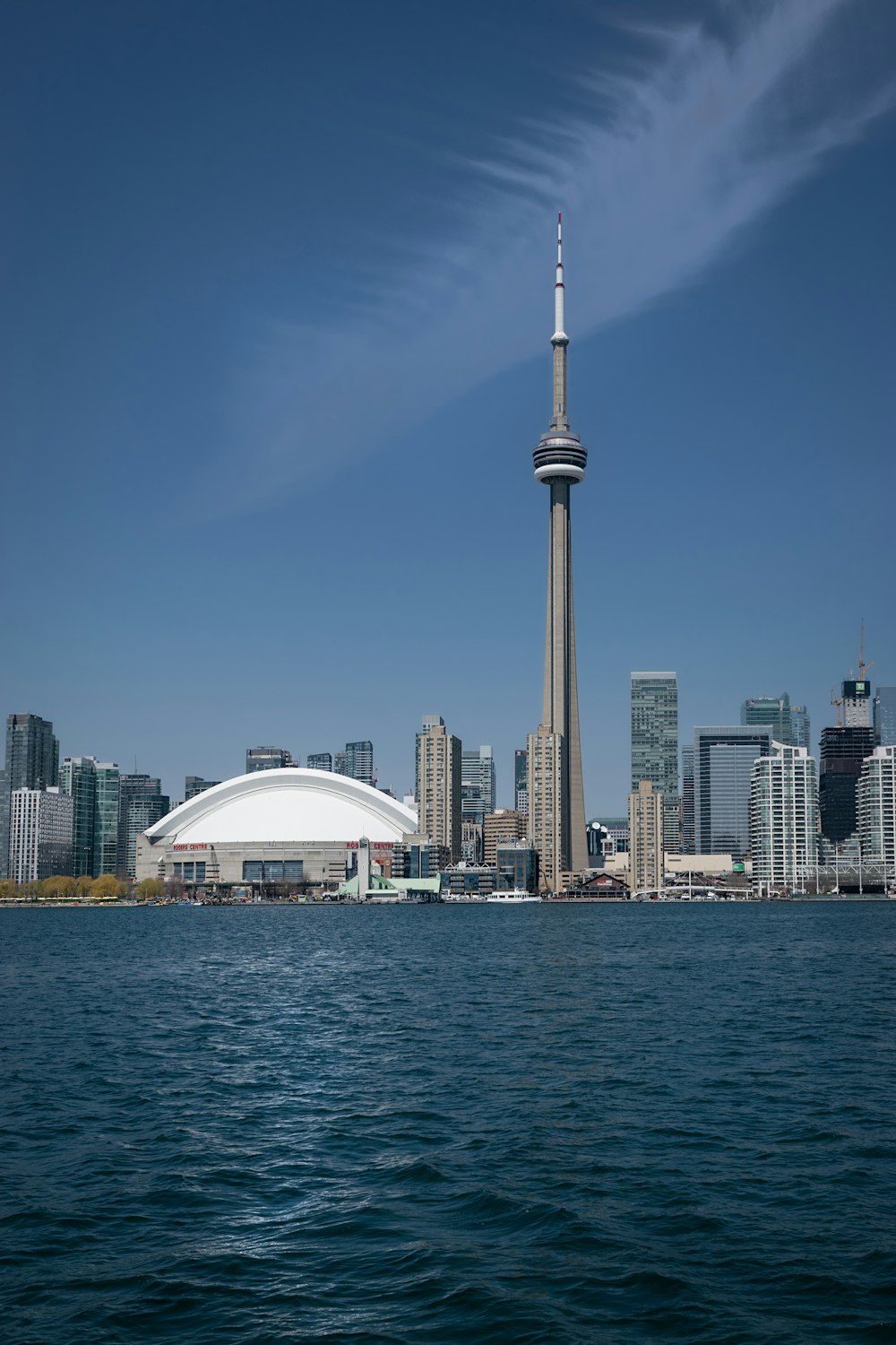 a large body of water with a city in the background