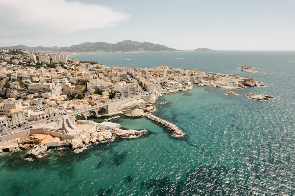 an aerial view of a city and the ocean