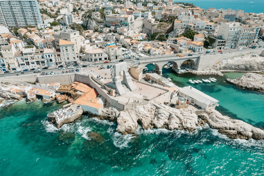 an aerial view of a city and the ocean