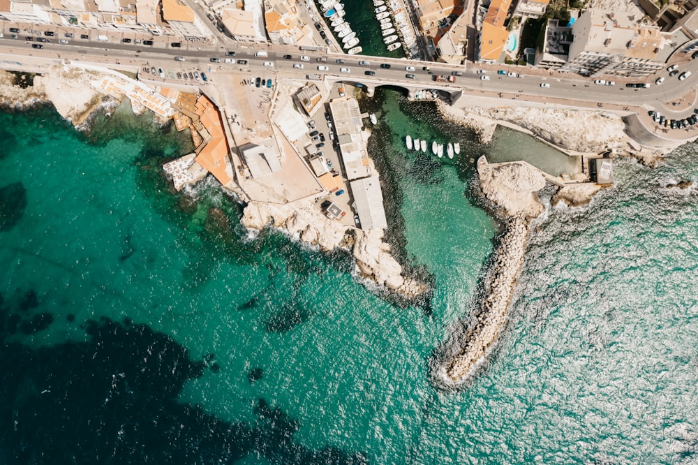 an aerial view of a bridge over a body of water