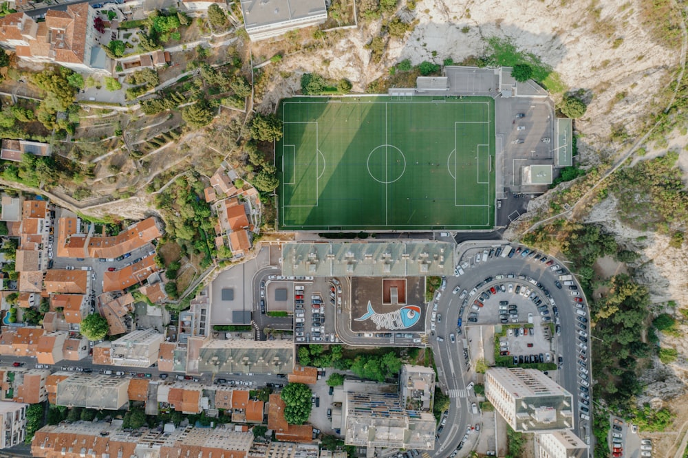 an aerial view of a soccer field in a city