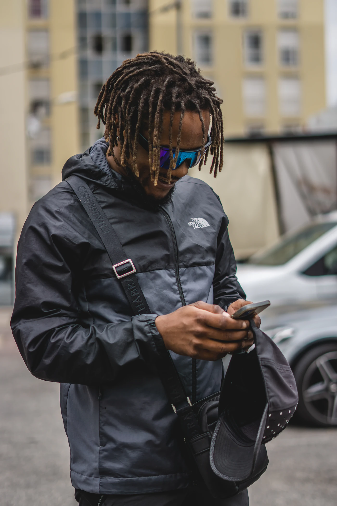 Person recharging their mobile phone using a digital top-up app