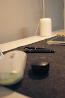 Modern desk organizer and device dock printed in vibrant colors, arranged neatly on an office desk.