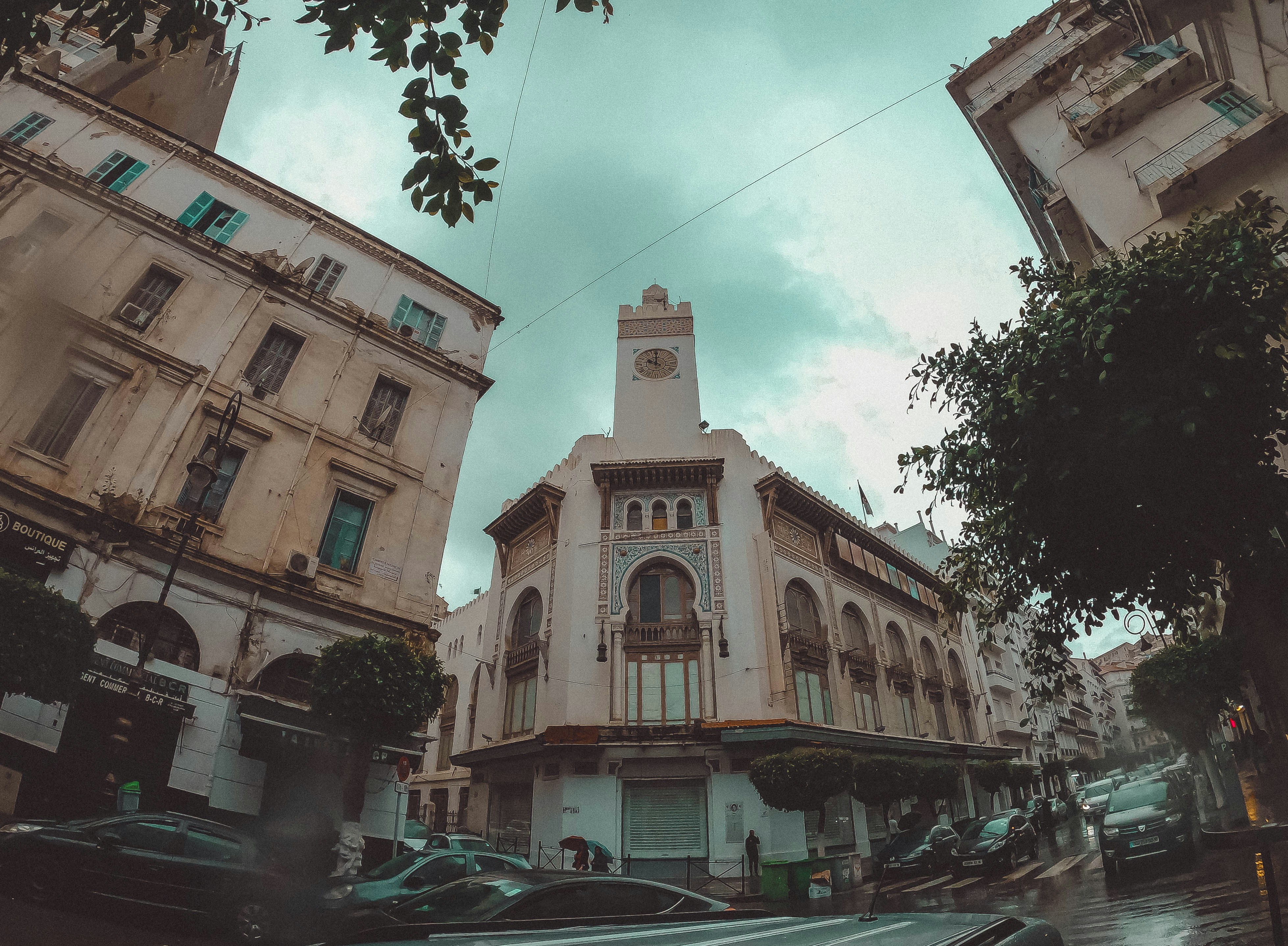 A tall building with a clock on the top of it photo – Free Clock Image ...