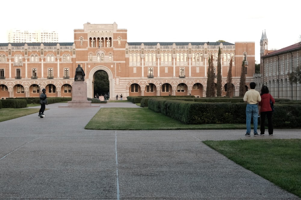 a group of people standing in front of a building