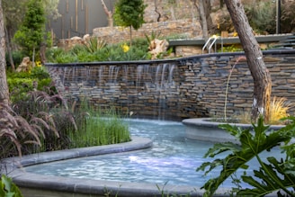 A serene water feature enhancing the garden's charm.