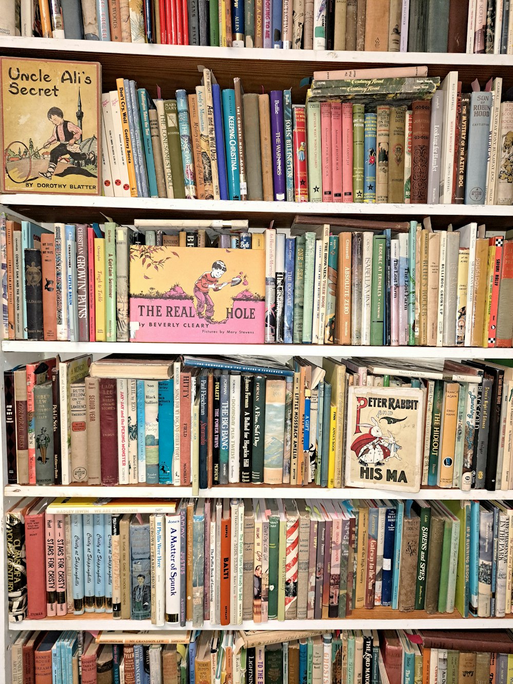 a book shelf filled with lots of books