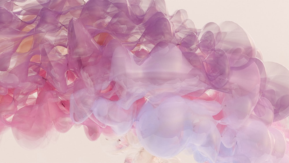 Un bouquet de ballons roses et violets flottant dans les airs