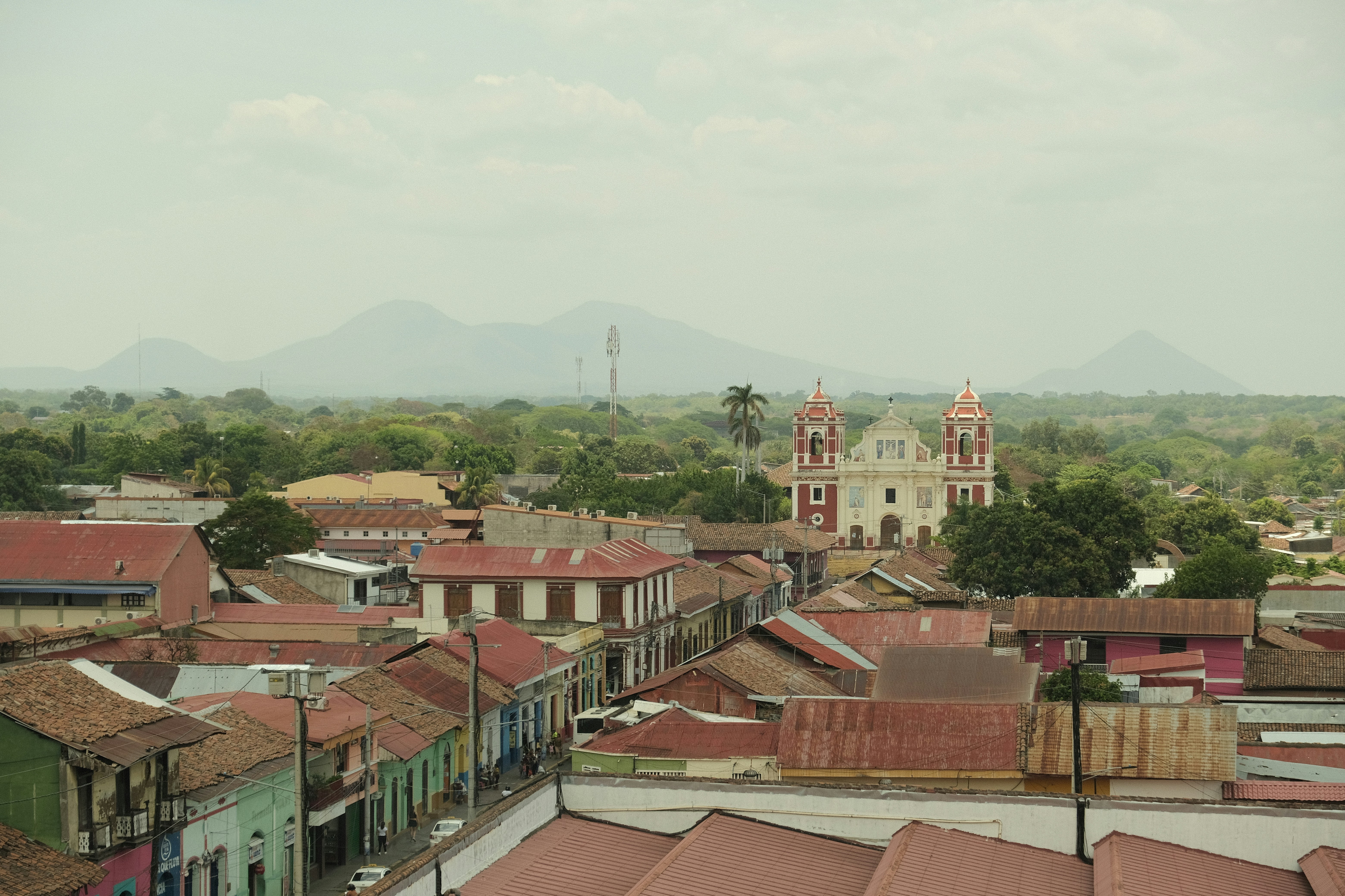 a view of a city with a church in the background