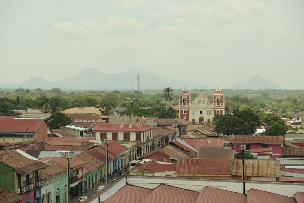 a view of a city with a church in the background