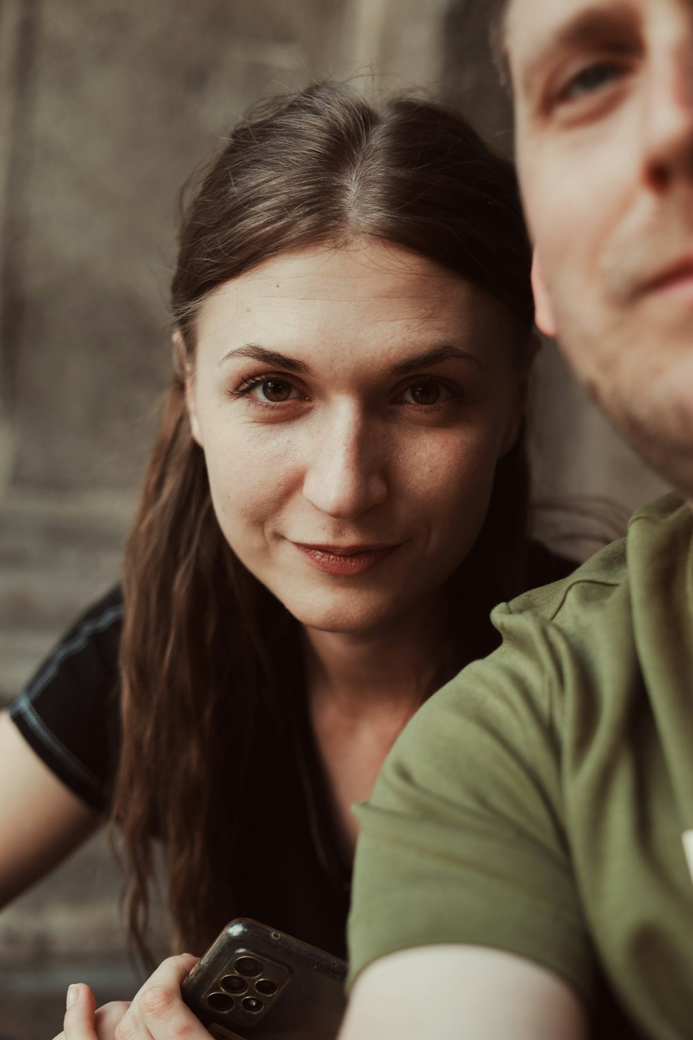 a man and a woman sitting next to each other