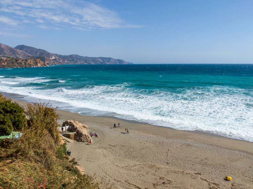 a view of a beach with people on it