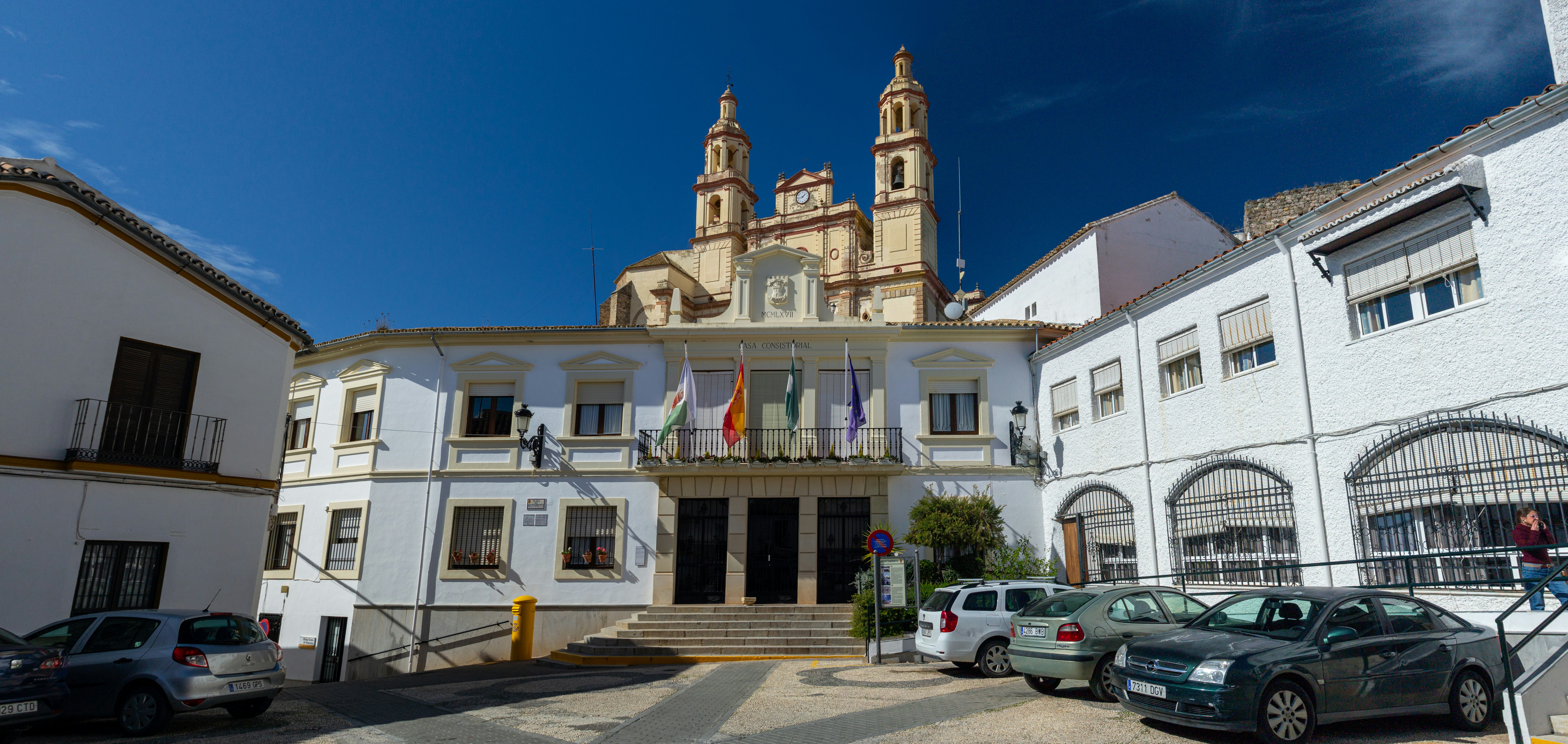 a large white building with a clock tower on top of it